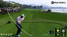 In-Game Screenshot 4 - A professional golfer swinging for a perfect drive in EA Sports PGA Tour, with a detailed crowd and coastal golf course in the background. Master the game with precision mechanics and get your Steam digital key now at RushGame.co
