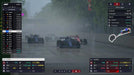 F1 Manager 2023 gameplay screenshot of a wet race, with Williams and Ferrari cars battling through heavy rain, creating a dramatic mist on the track. Secure your F1 Manager 2023 Deluxe Edition PC Steam CD Key at RushGame.co and master unpredictable weather conditions in F1 racing
