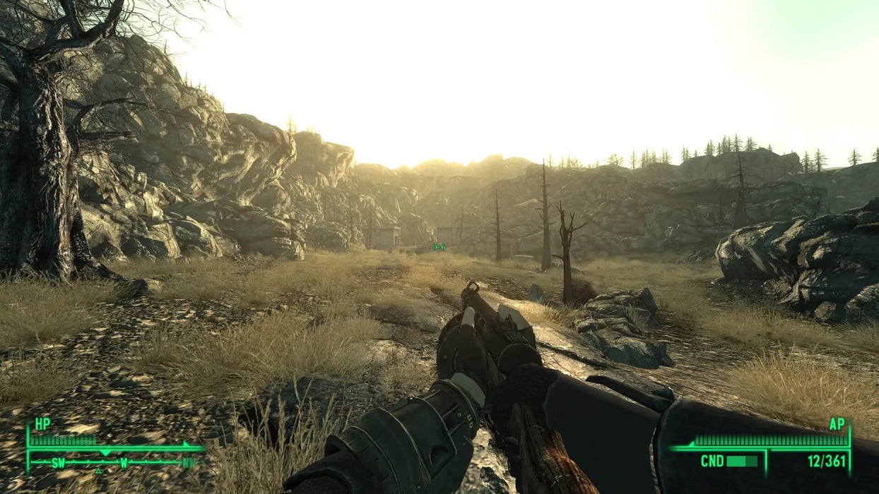 Gameplay Screenshot: First-person exploration in Fallout 3, depicting a wasteland landscape with a rugged survivor and a post-apocalyptic setting. Get Fallout 3 GOTY Steam Key at RushGame.co