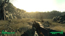Gameplay Screenshot: First-person exploration in Fallout 3, depicting a wasteland landscape with a rugged survivor and a post-apocalyptic setting. Get Fallout 3 GOTY Steam Key at RushGame.co