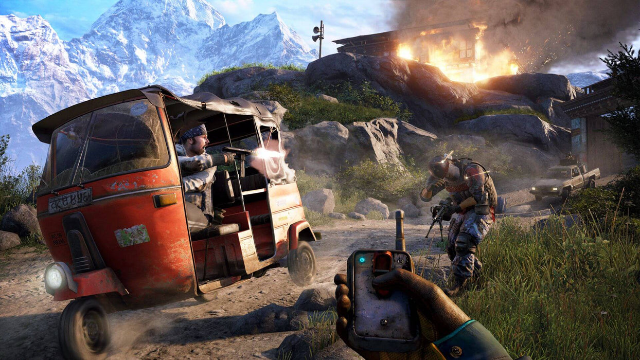 Intense firefight in Far Cry 4 on PC, featuring a player aiming a remote detonator while a bandit fires from a red auto rickshaw, with a burning building in the background. Buy your Ubisoft Connect CD Key today at RushGame.co and dive into this thrilling open-world adventure