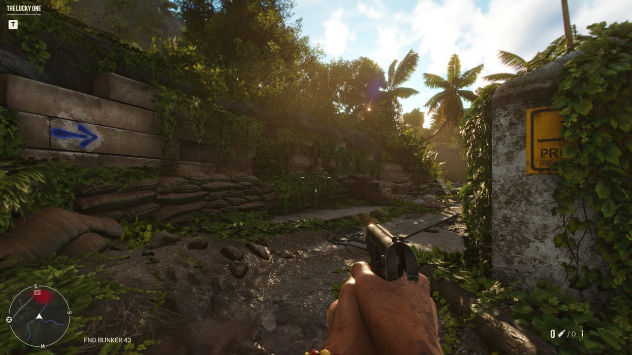 Far Cry 6 PC gameplay screenshot showcasing a first-person view of a player exploring an overgrown bunker entrance in the jungles of Yara, with a pistol ready for combat. Buy your Ubisoft Connect CD Key at RushGame.co and experience the open-world revolution