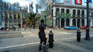 Detailed cityscape screenshot from FINAL FANTASY XV Windows Edition, where Noctis explores a vibrant urban environment full of life. Order your instant Steam CD Key now at RushGame.co