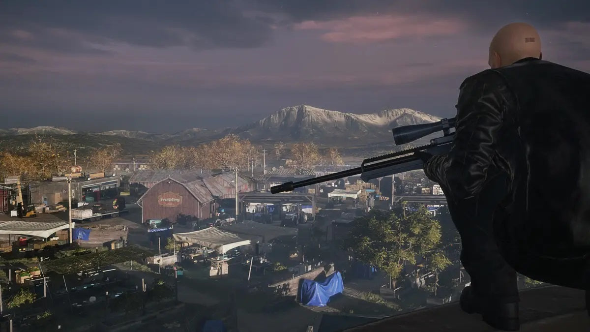 Hitman: Game of The Year Edition - Agent 47 with a sniper rifle on a hill