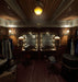 In-game screenshot from Layers of Fear 2 on PC GOG showing a vintage dressing room with twin mirrors and dim lighting, capturing the eerie atmosphere – available as a digital game key at RushGame.co