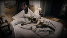 Scene from Layers of Fear 2 for PC GOG depicting a burnt mannequin lying in a luxurious bed, emphasizing the surreal horror elements of the game – get your digital copy at RushGame.co