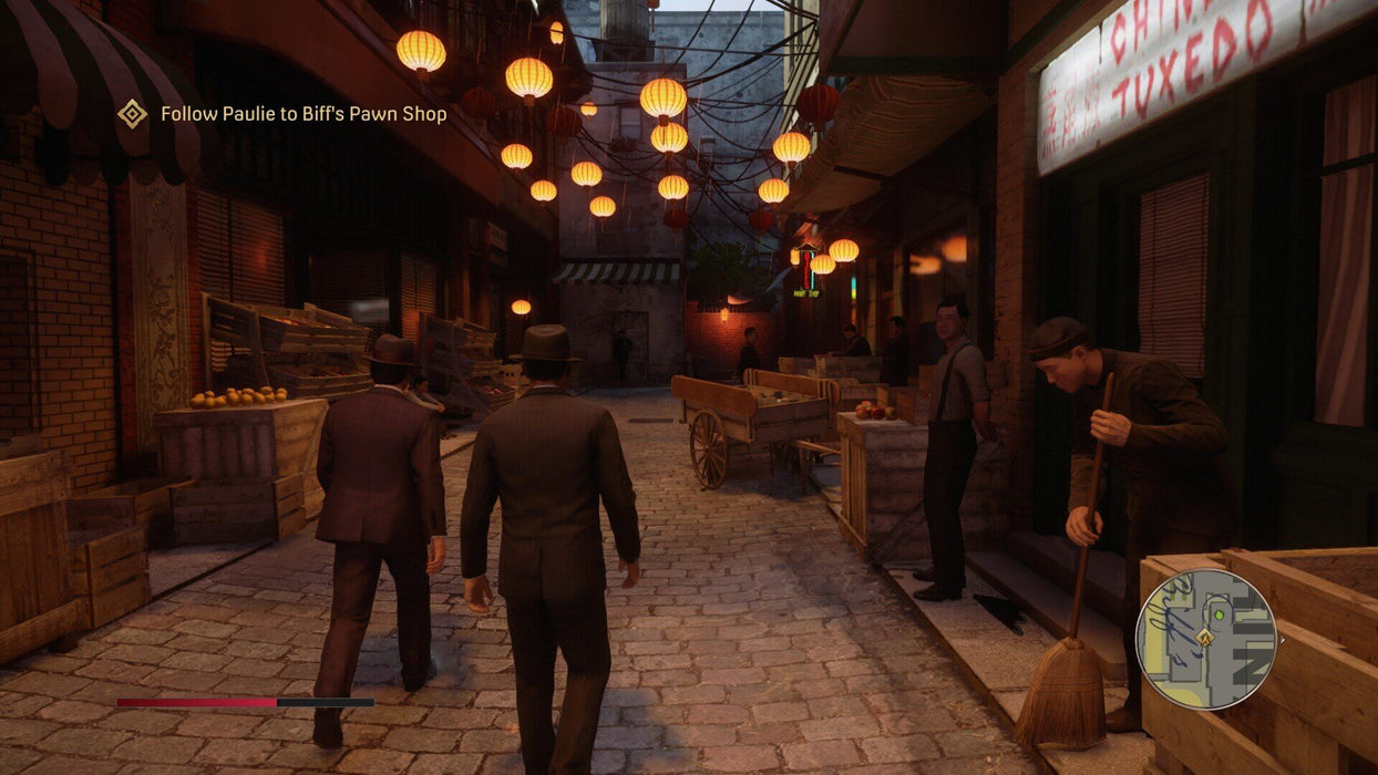 A dark and moody alleyway in Mafia Definitive Edition on PC Steam, lit by glowing lanterns as the main characters walk through. Immerse yourself in this authentic 1930s world and grab your Steam game key at RushGame.co