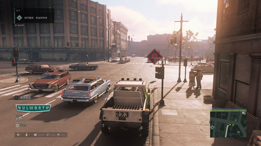 Street scene from Mafia III Definitive Edition on Steam, with a pickup truck at an intersection during daylight, surrounded by vintage cars and pedestrians on the sidewalk.