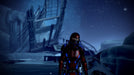 Commander Shepard exploring an icy, mysterious planet with remnants of a destroyed structure under a starry sky. Available on EA Play for PC at RushGame.co