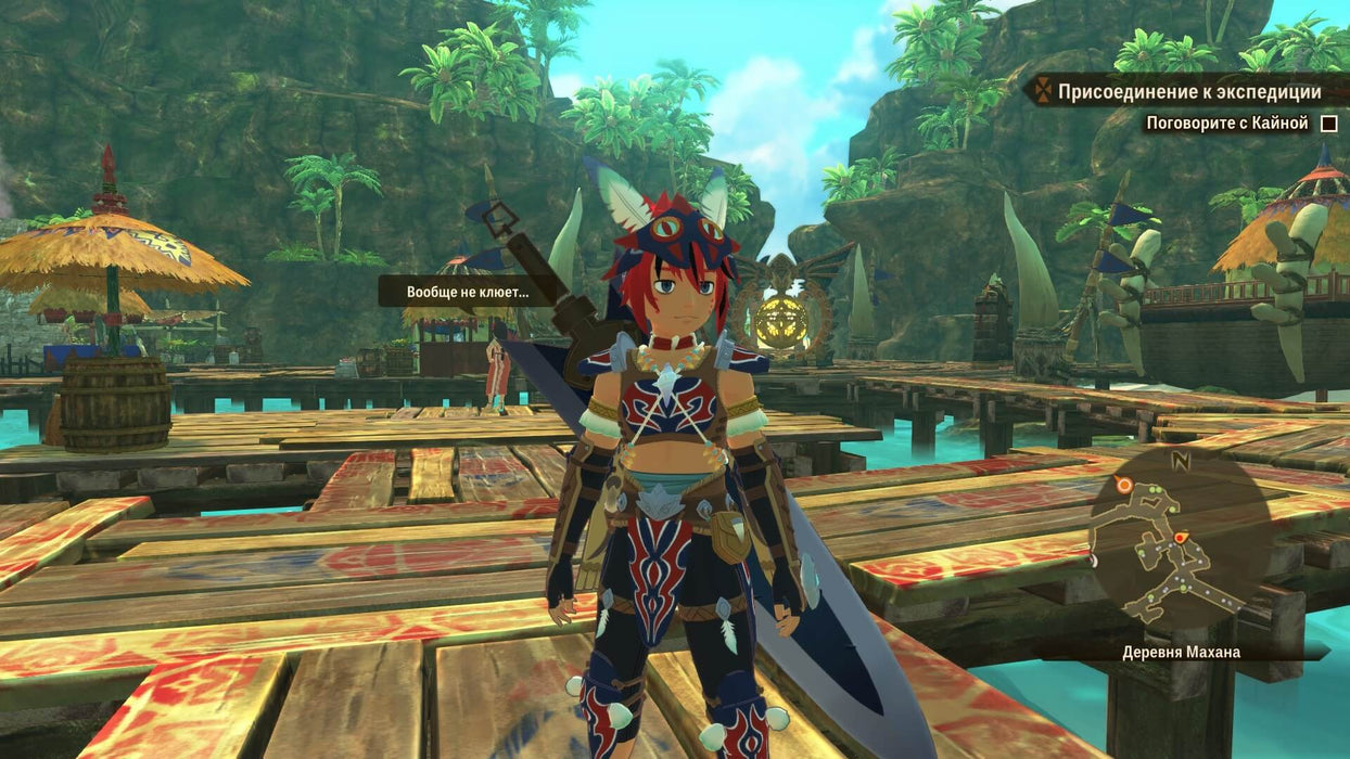 A player character stands in the tropical village of Mahana in Monster Hunter Stories 2: Wings of Ruin Deluxe Edition, equipped with vibrant armor and a large sword. The setting is filled with lush green foliage and wooden structures, creating a lively atmosphere. Buy this game on RushGame.co for an immersive RPG experience