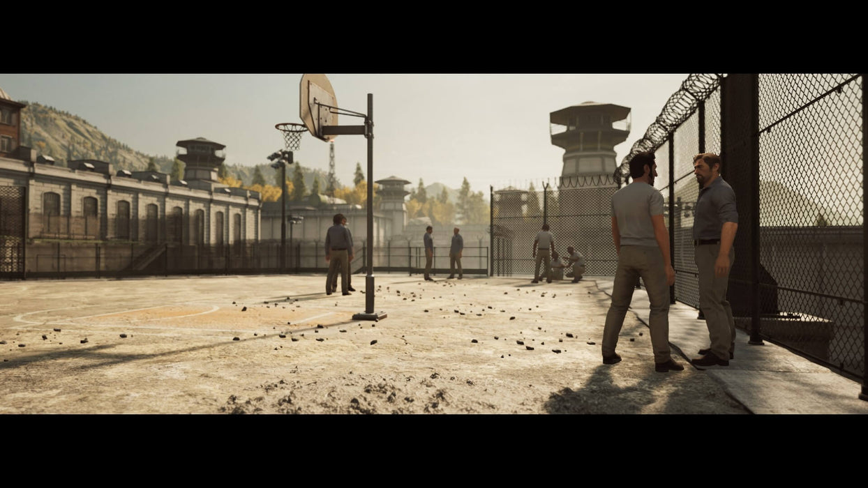 In-game scene from A Way Out with two players exploring a prison yard filled with inmates. Purchase your digital game code at RushGame.co for a unique co-op experience on Xbox One & Series X/S