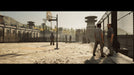 In-game scene from A Way Out with two players exploring a prison yard filled with inmates. Purchase your digital game code at RushGame.co for a unique co-op experience on Xbox One & Series X/S