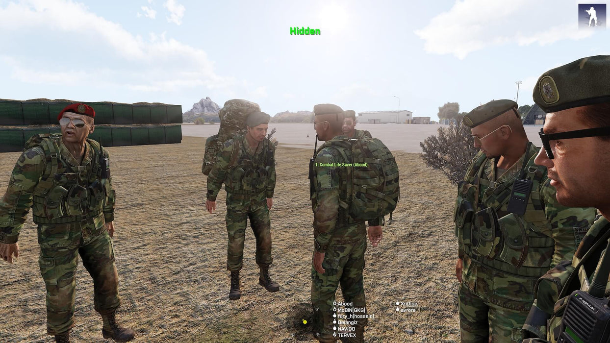 A group of soldiers in camouflage uniforms engaging in a strategy discussion in a military base. Prepare for immersive tactical gameplay—purchase your Arma 3 Ultimate Edition PC CD Key at RushGame.co