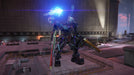 "A towering combat mech wields an energy weapon, glowing blue, inside an industrial complex in Armored Core VI: Fires of Rubicon. Buy your Steam CD Key now at RushGame.co and experience intense mech battles with advanced customization.
