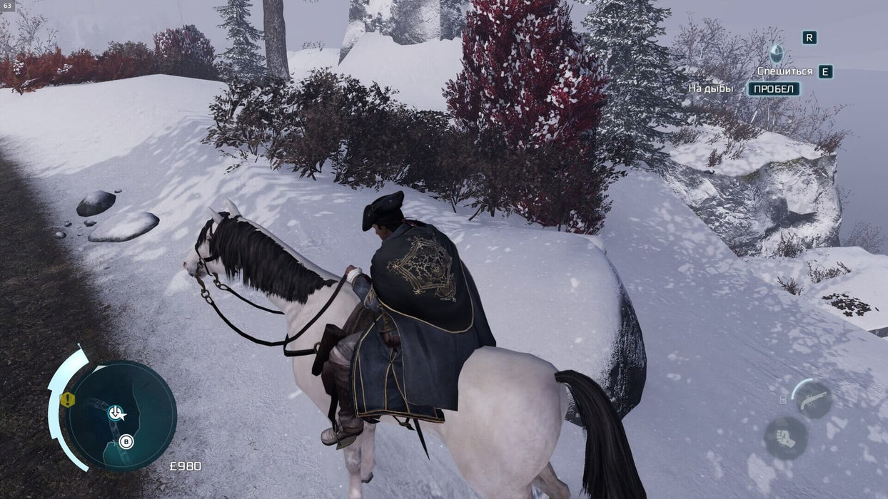 A winter landscape in Assassin's Creed III Remastered, where a cloaked rider traverses a snowy mountain path on horseback. Unlock the full adventure and explore the American Revolution in stunning detail with an Assassin's Creed III Remastered PC Ubisoft Connect CD Key available now at RushGame.co.