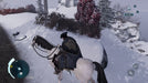A winter landscape in Assassin's Creed III Remastered, where a cloaked rider traverses a snowy mountain path on horseback. Unlock the full adventure and explore the American Revolution in stunning detail with an Assassin's Creed III Remastered PC Ubisoft Connect CD Key available now at RushGame.co.