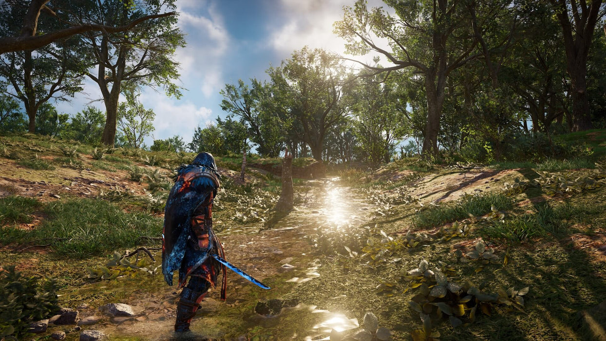 A cloaked Viking warrior walks through a lush forest with sunlight reflecting off a water stream, creating an immersive open-world experience. Buy your Assassin’s Creed Valhalla Xbox digital key now at RushGame.co for the ultimate adventure.