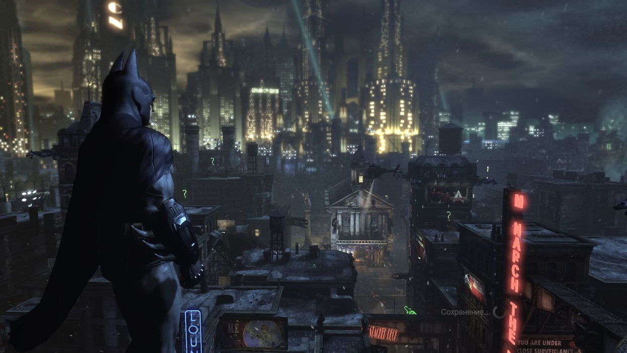 A stunning nighttime cityscape of Gotham from Batman: Arkham City GOTY, with Batman standing atop a building, surveying the neon-lit skyline. The dark and gritty atmosphere, complete with iconic landmarks and glowing Riddler question marks, captures the essence of the game's open-world experience. Find your Batman: Arkham City GOTY PC Steam CD Key at RushGame.co for an instant activation