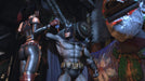 This in-game scene from Batman: Arkham City GOTY captures an intense moment between Batman and Harley Quinn in a dark, industrial setting. Batman stands tall as Harley Quinn, clad in her signature black and red outfit, taunts him with a mischievous expression. Unlock the full Batman: Arkham City GOTY experience with a PC Steam CD Key from RushGame.co
