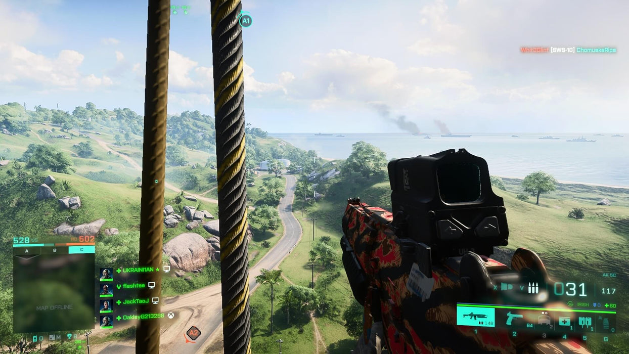 Battlefield 2042 tactical engagement, with a soldier aiming a futuristic assault rifle from a high vantage point overlooking a lush coastal battlefield