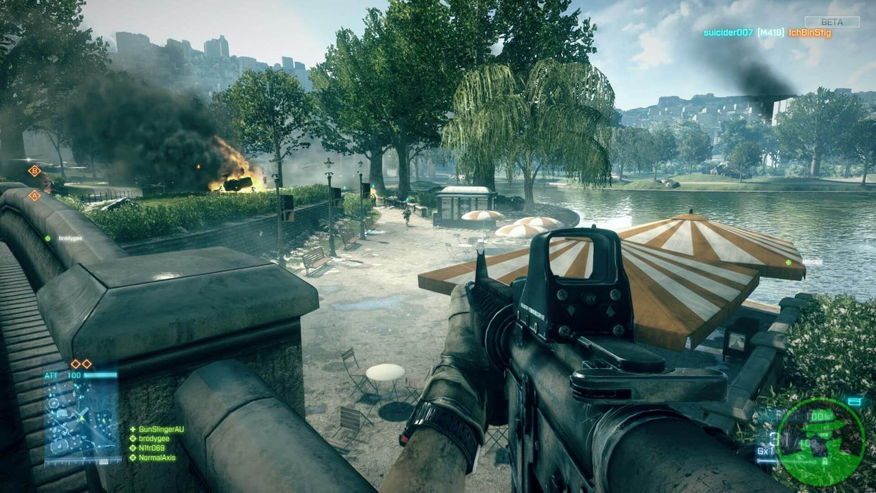 Battlefield 3 squad-based warfare scene, with medics assisting fallen soldiers on a war-torn battlefield
