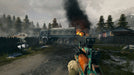 A player aiming a customized assault rifle at a burning military truck in a war-torn village, with mountains and dark clouds in the background in Battlefield 4. Purchase your digital key instantly at RushGame.co
