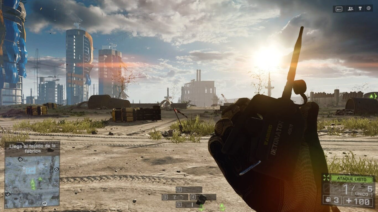"Gameplay scene from Battlefield 4, depicting a soldier holding a detonator in a war-torn urban battlefield with towering buildings in the distance under a setting sun