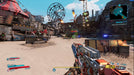 A first-person perspective of a player aiming a futuristic weapon in a post-apocalyptic amusement park in Borderlands 3. The scene features a Ferris wheel, makeshift structures, and enemy targets in the distance. Purchase Borderlands 3 CD key at RushGame.co for an action-packed adventure