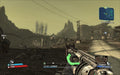 Gameplay Screenshot 
A first-person shooter view in Borderlands: Game of the Year Edition, showing a player aiming a shotgun in a desolate wasteland with industrial structures in the distance. Experience the action with a digital key from RushGame.co