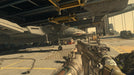 A first-person gameplay scene from Call of Duty: Advanced Warfare, where the player is holding a futuristic assault rifle inside an aircraft hangar with a jet fighter marked with a shark mouth design. Secure your Call of Duty: Advanced Warfare Gold Edition Xbox One CD Key US at RushGame.co and take part in high-tech combat scenarios with cutting-edge weaponry