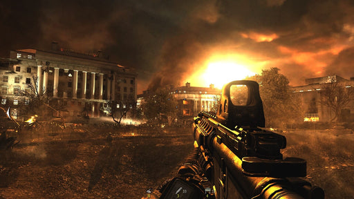 Gameplay Screenshot  A dramatic first-person view of an urban warfare battle with a large government building under siege, engulfed in fire and explosions. Relive the classic Modern Warfare 2 campaign—get your PC Steam CD Key today at RushGame.co