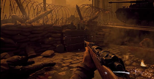 Gameplay Image: A first-person perspective of a soldier holding a classic bolt-action rifle, taking cover behind sandbags in a war-torn battlefield filled with barbed wire and debris. Buy your Call of Duty: Vanguard Xbox Series X|S CD Key at RushGame.co and immerse yourself in the gripping single-player campaign and online multiplayer