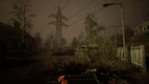 Gameplay screenshot: A misty, abandoned village with rusted fences, old houses, and overgrown vegetation from Chernobylite Enhanced Edition. Experience the hauntingly realistic atmosphere of Chernobyl in this survival horror RPG—get your PC Steam CD Key now at RushGame.co