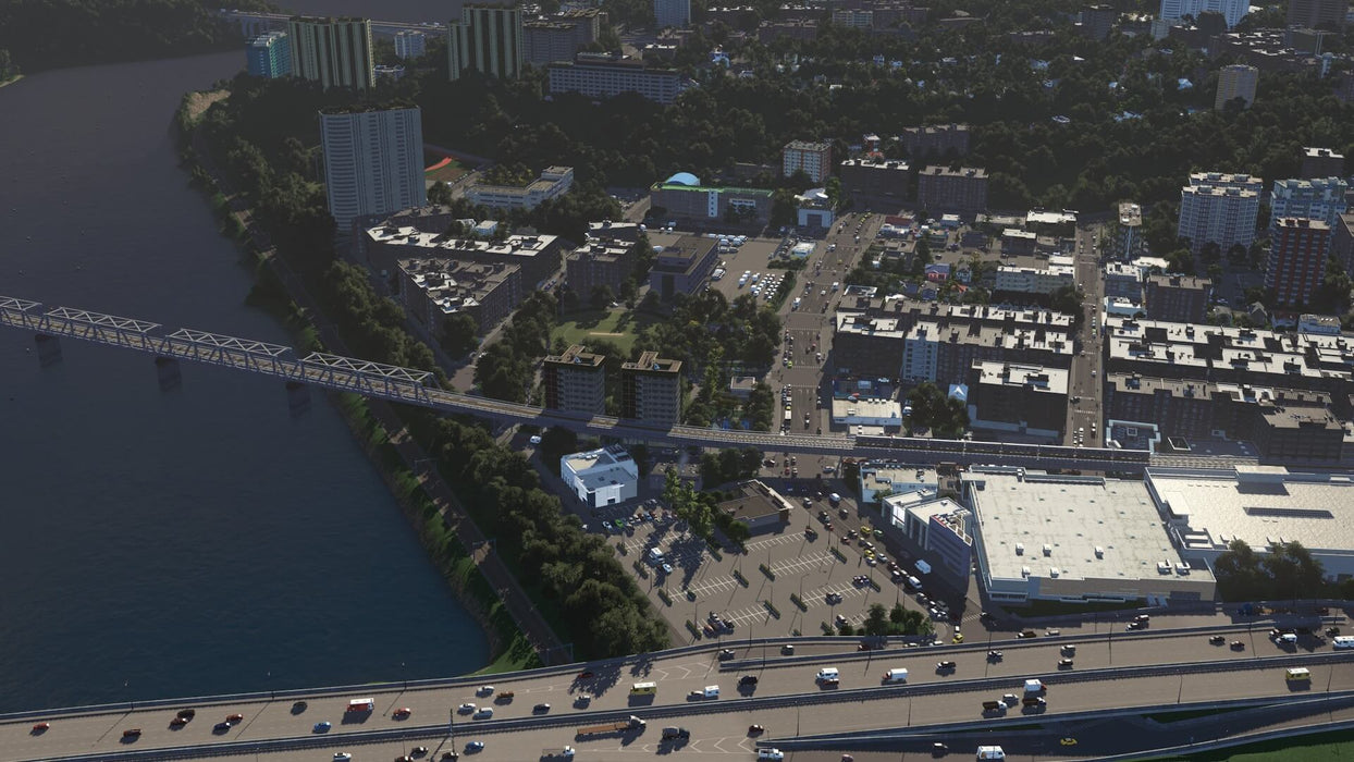 Gameplay screenshot: A picturesque view of a riverside city featuring multiple bridges, highways, and densely packed buildings, highlighting the game's in-depth urban planning mechanics. Get your Cities: Skylines Complete Edition digital key at RushGame.co and construct the city of your dreams with detailed economic and zoning tools.