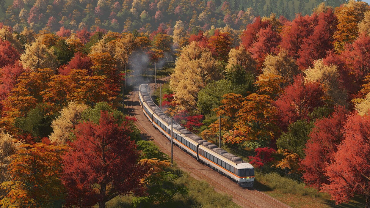 gameplay screenshot: A breathtaking autumn railway scene from Cities: Skylines - Mass Transit DLC, showcasing a passenger train winding through a dense forest with vibrant red, yellow, and orange leaves. Secure your Cities: Skylines Mass Transit Steam CD Key at RushGame.co and build an efficient public transit system in your city