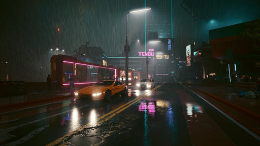 Cyberpunk 2077 PC GOG CD Key - Screenshot 1 – A rainy neon-lit street in Night City with cyberpunk aesthetics. A futuristic car with glowing red tail lights drives down the wet road, reflecting the vibrant lights of billboards and holograms. Purchase Cyberpunk 2077 for PC at RushGame.co and immerse yourself in this dystopian world