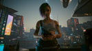 Cyberpunk 2077 PC GOG CD Key - Screenshot 2 – A close-up of a female character with short, dyed hair and cybernetic tattoos, standing in a futuristic high-rise with a view of Night City’s skyline filled with digital billboards. Experience the immersive world of Cyberpunk 2077—buy your game key now at RushGame.co