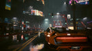 Cyberpunk 2077 PC GOG CD Key - Screenshot 3 – A nighttime cityscape in Cyberpunk 2077, featuring a neon-drenched urban street with heavy rain and futuristic billboards. A sleek sports car with glowing taillights moves through the dark, wet streets. Get your digital CD key for Cyberpunk 2077 at RushGame.co and explore the vibrant streets of Night City