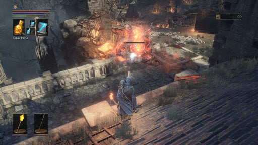 Gameplay screenshot: A warrior casts a powerful fire spell in Dark Souls III, surrounded by the ruins of a gothic stronghold. Master the flames—buy your Deluxe Edition Steam key at RushGame.co!