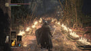 Dark Souls III - Player Facing a Firelit Path: A heavily armored warrior walks down a candlelit path surrounded by swords embedded in the ground, creating an eerie yet majestic atmosphere in Dark Souls III. Get your Dark Souls III CD Key now at RushGame.co