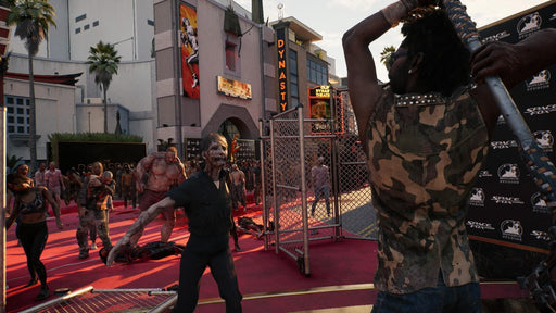 Dead Island 2 gameplay screenshot – red carpet zombie horde – A player prepares to swing a melee weapon at an approaching zombie horde on a bloodstained red carpet in front of the Dynasty theater, capturing the game's brutal combat and undead mayhem. Buy Dead Island 2 CD Key at RushGame.co