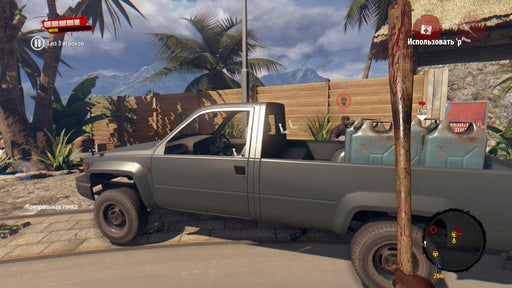 Gameplay screenshot: A first-person perspective from Dead Island: Definitive Collection showing a survivor holding a bloodied bat while standing near a gray pickup truck loaded with fuel cans. The background features a tropical setting with palm trees and a wooden fence. Buy Dead Island: Definitive Collection Xbox One CD Key at RushGame.co for an immersive zombie survival experience.