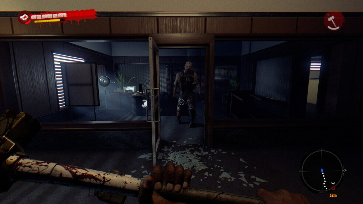 Gameplay screenshot: A tense in-game moment from Dead Island Definitive Edition, showing a first-person view of a player holding a bloodied sledgehammer, facing an approaching zombie inside a dimly lit office. Buy the game key at RushGame.co