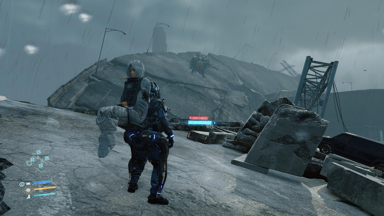 Gameplay screenshot: Intense scene from Death Stranding: Director's Cut where Sam Porter Bridges carries an NPC through a stormy, ruined landscape. In the distance, a terrifying BT (Beached Thing) looms, adding to the tension of this unique survival experience. Secure your Steam CD Key at RushGame.co