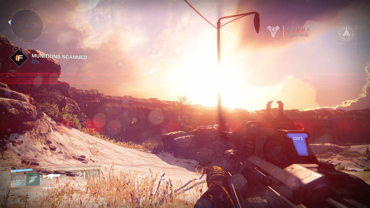 Gameplay screenshot: A first-person perspective in Destiny: The Collection on Xbox One, featuring a Guardian aiming their futuristic weapon at the horizon as the sun sets, casting a dramatic orange glow. Available now at RushGame.co