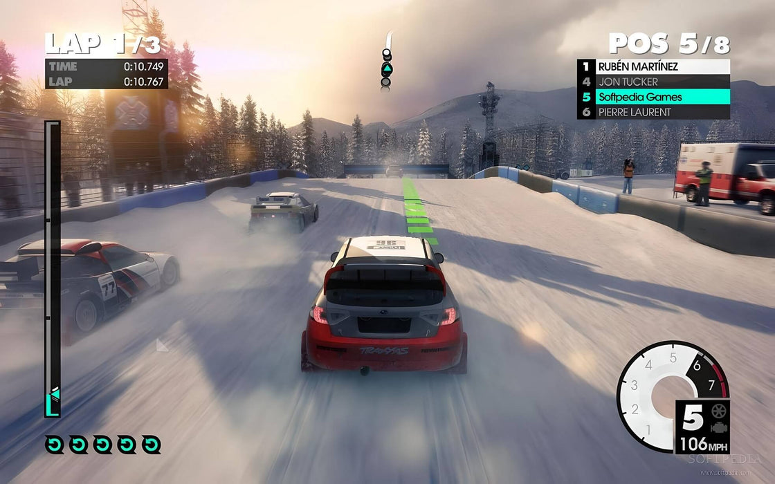 Gameplay screenshot - Snowy racing action in DiRT 3 Complete Edition as multiple cars drift across an icy track, kicking up powder. The on-screen UI shows the player's position and lap time, immersing players in thrilling rallycross competition. Get your digital code now at RushGame.co