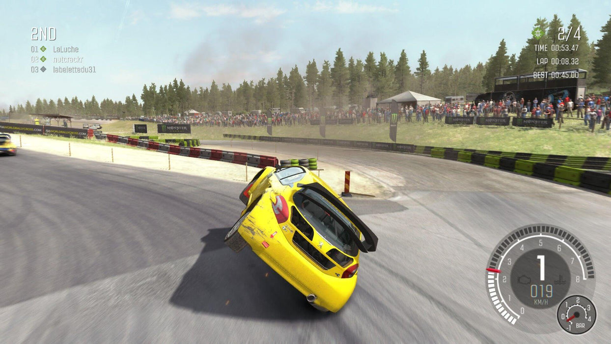 DiRT Rally Gameplay screenshot – Rallycross Racing Accident – A yellow rally car flips onto two wheels on a tight corner during a high-speed rallycross race, with a large crowd in the background. Experience the adrenaline of off-road racing with a Steam key from RushGame.co