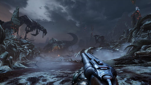 Gameplay screenshot - A chilling first-person view in DOOM for PC Steam, showing the player aiming a shotgun at a desolate, demon-infested wasteland with massive skeletal remains. Experience brutal FPS combat—buy your DOOM Steam key now at RushGame.co