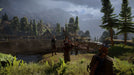 Gameplay screenshot - A party of adventurers in Dragon Age: Inquisition standing near a tranquil lakeside, surrounded by lush greenery and towering mountains. Experience breathtaking open-world exploration—buy your Dragon Age: Inquisition PC EA Play CD Key now at RushGame.co