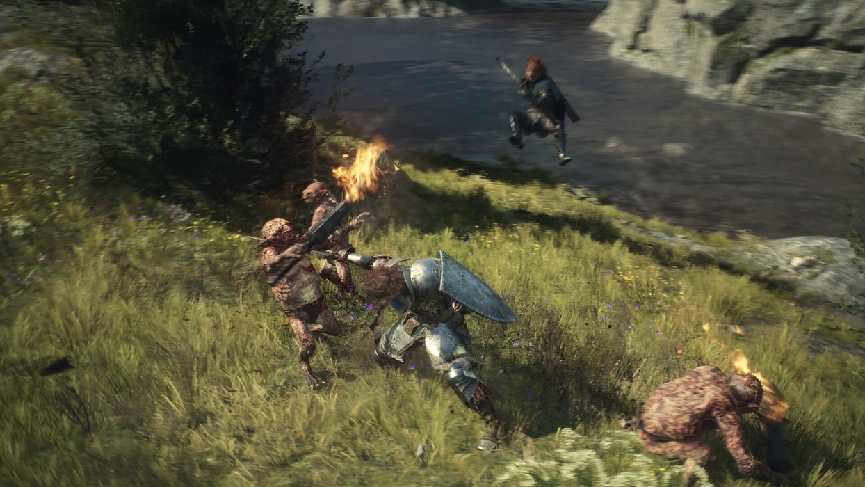 Gameplay image - A warrior clad in heavy armor engages in a fierce battle against grotesque monsters in a lush, green landscape in Dragon’s Dogma 2. Experience epic combat and dynamic battles in this open-world RPG, available now at RushGame.co